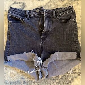 Black high rise jean shorts.